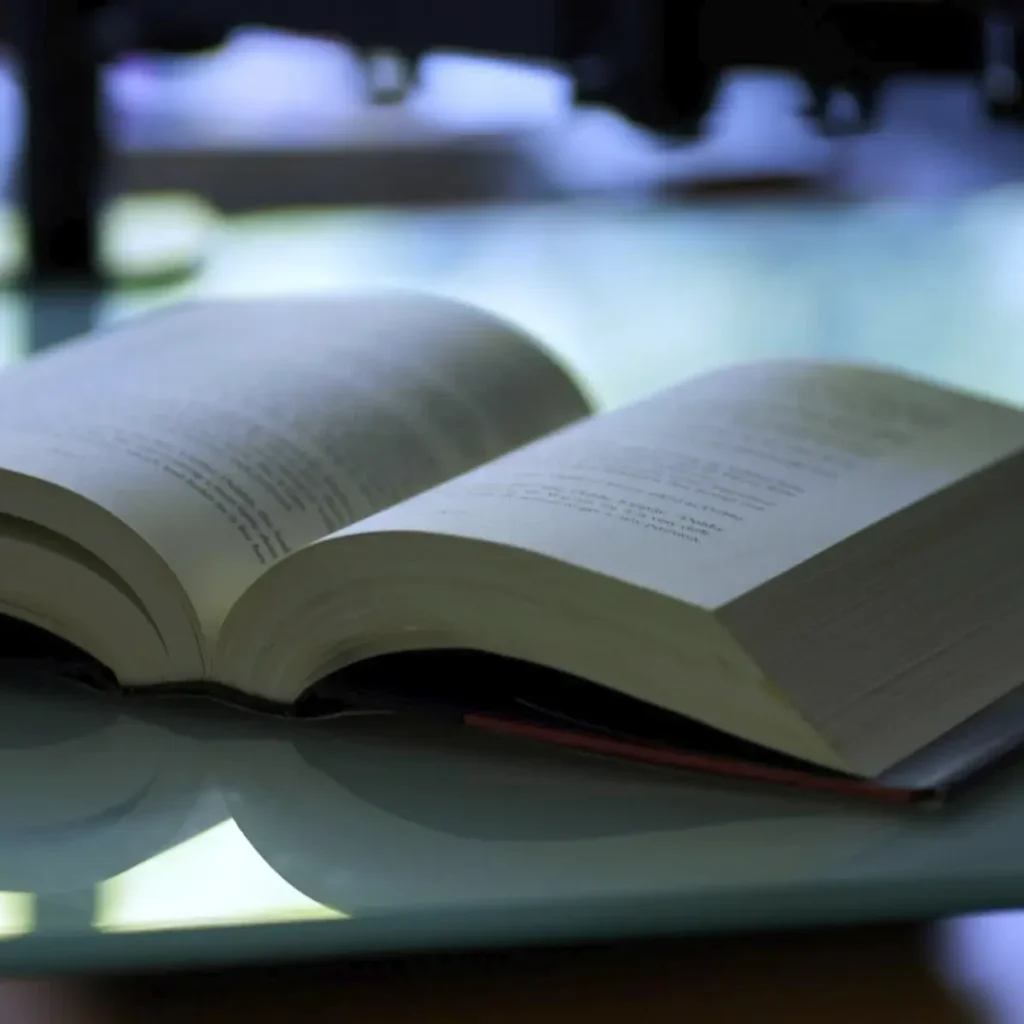 Open book with publications on a table